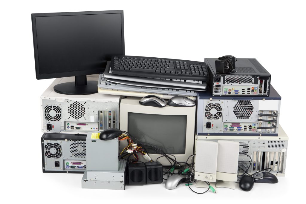 E-Waste, computers, screens and peripherals waiting to be recycled